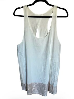 Lululemon s White Racerback Tank with Metallic Hem.  PTP 16”